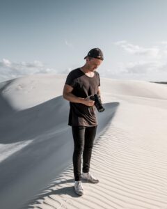 Photographer in Atlantic sand dunes